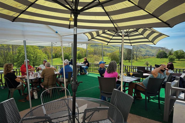 People Sitting Outside On The Deck